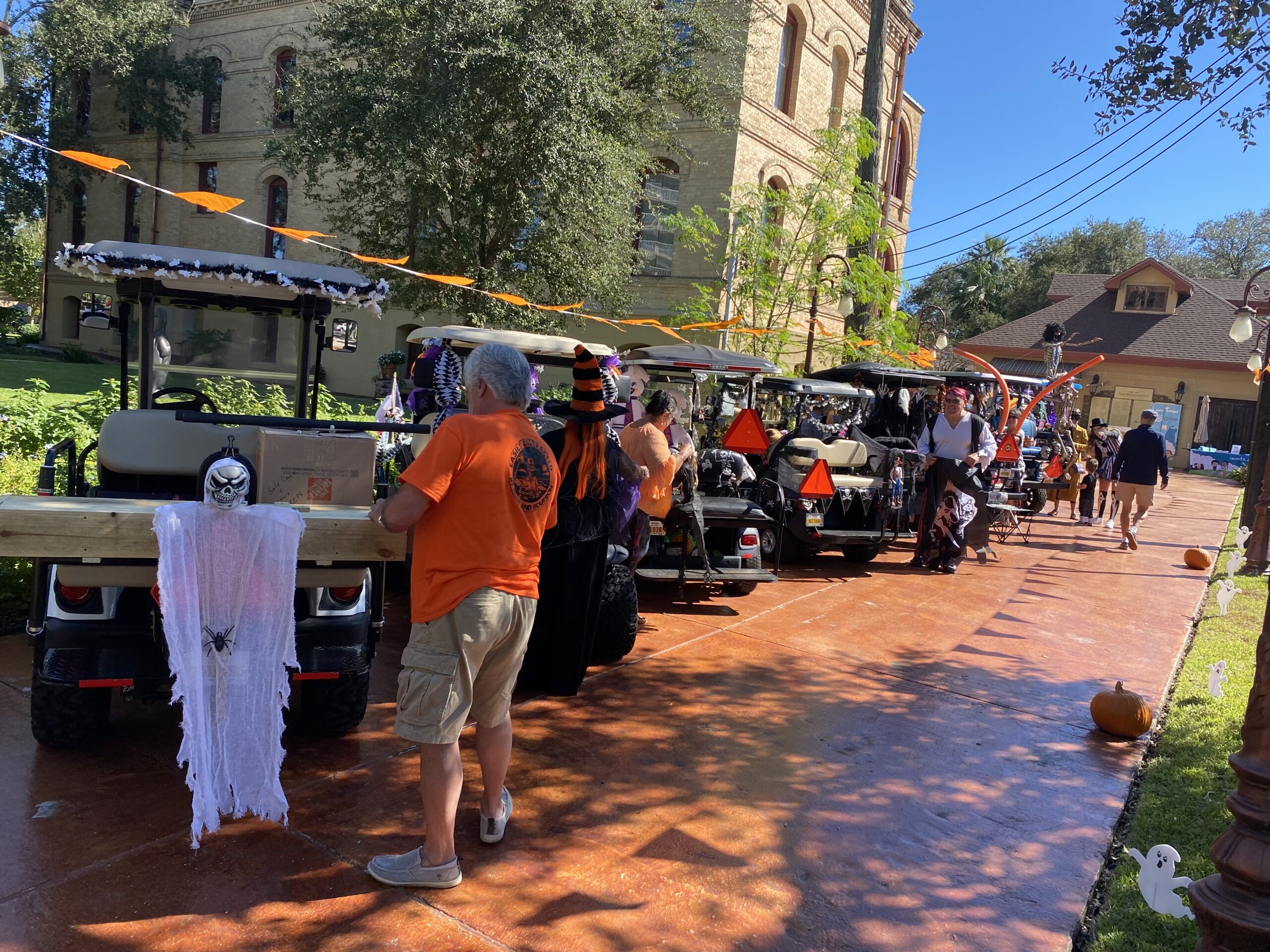 Golf carts and neighbors at a Galveston community event