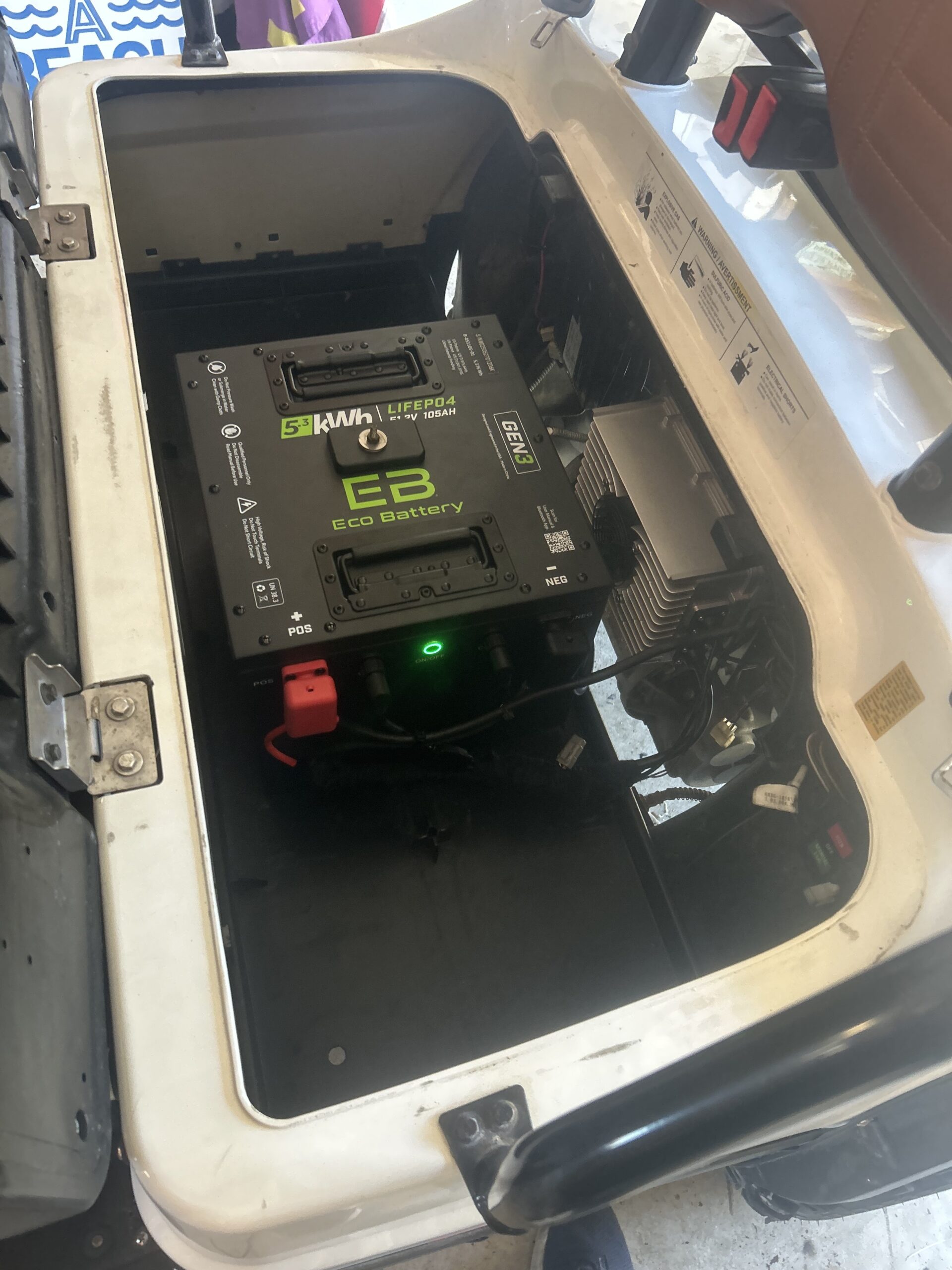 Historical under-seat battery compartment photograph