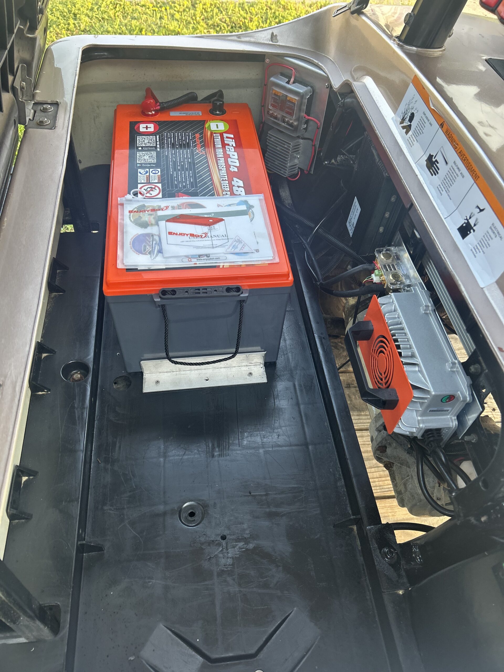 Historical golf cart battery compartment photograph